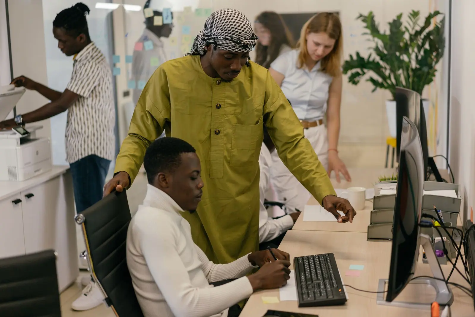 AI recruitment video — multicultural team collaborating at work, day-in-the-life capture direction still by ArcaneWiz