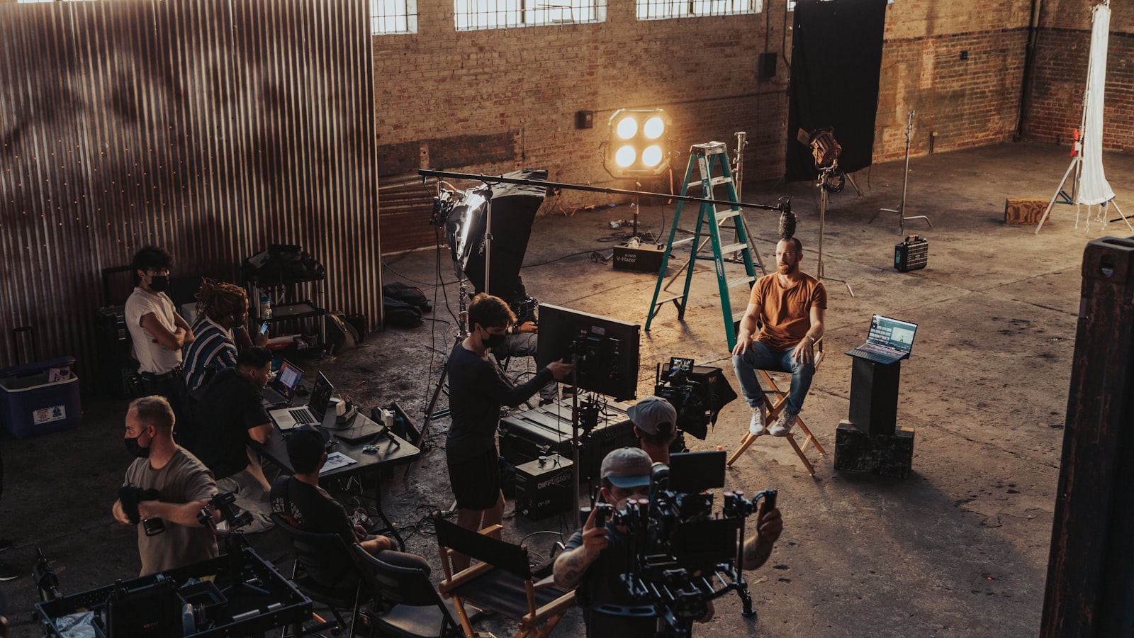 A cinematic video production set with crew, lighting and cameras — the director-led craft ArcaneWiz brings to every AI app promo video
