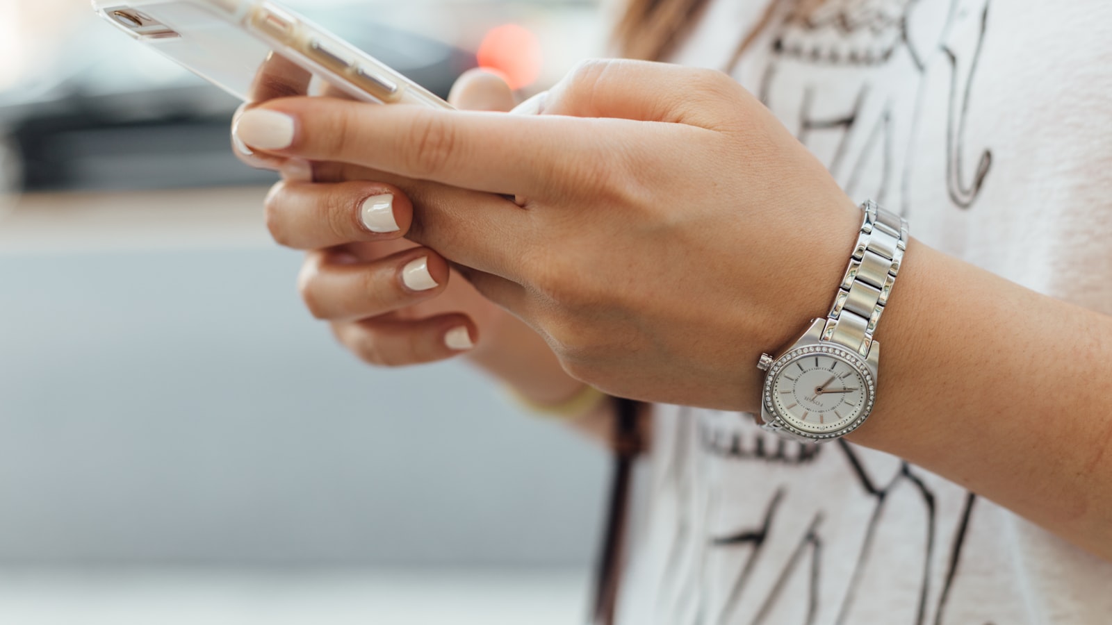 A person using a mobile app on a smartphone — the buyer moment an app promo video is built to drive from App Store and paid-social placements
