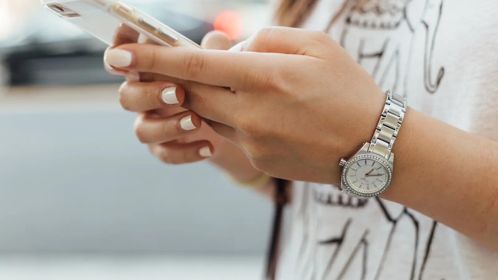 A person using a mobile app on a smartphone — the buyer moment an app promo video is built to drive from App Store and paid-social placements