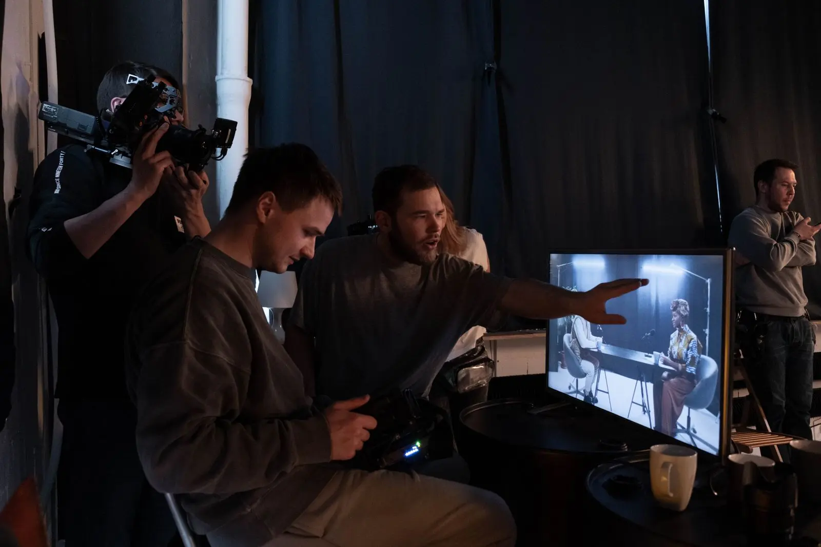Crew at grading monitors · direction